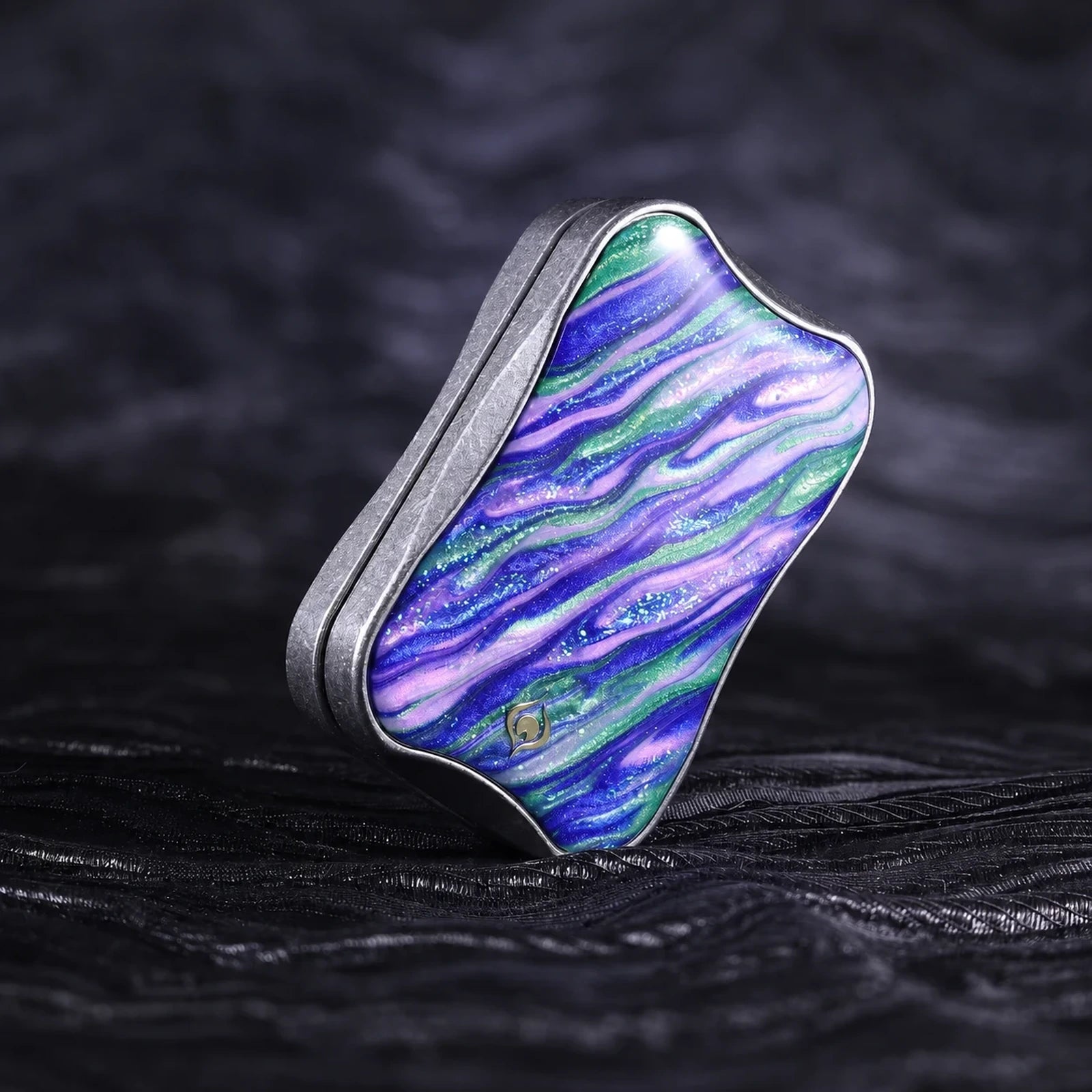 Metal fidget slider with blue green and purple sculpted color inlay