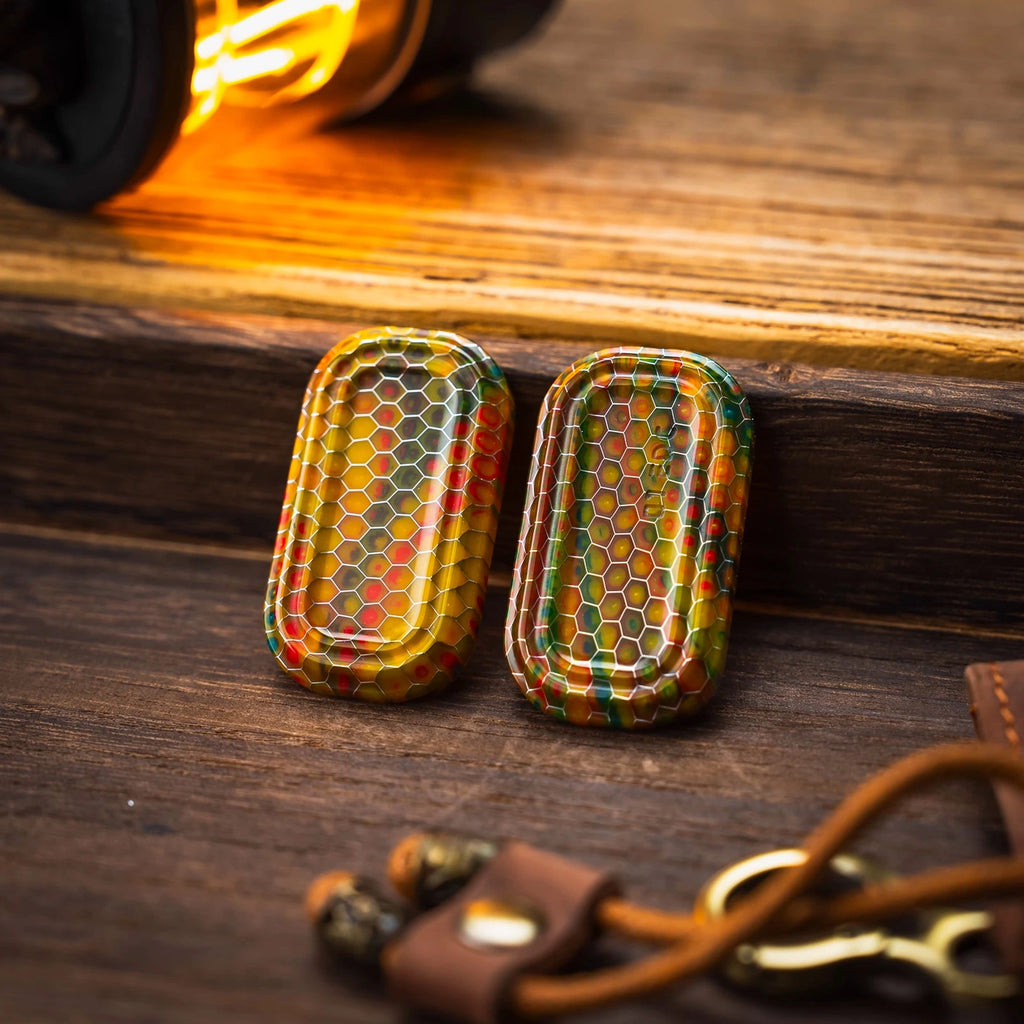 Two warm-tone patterned outer shells for the modular fidget slider