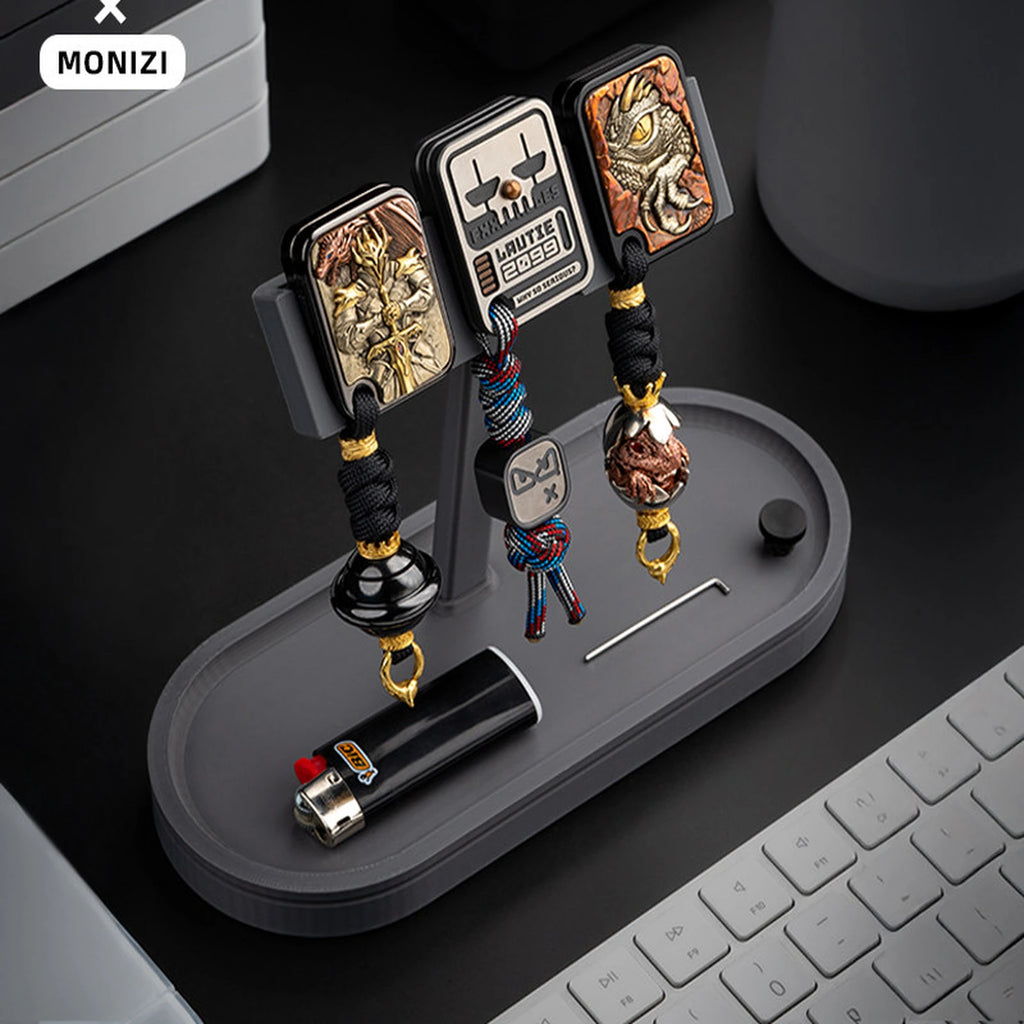 Dark gray modular pegboard stand with hanging pendants and base tray