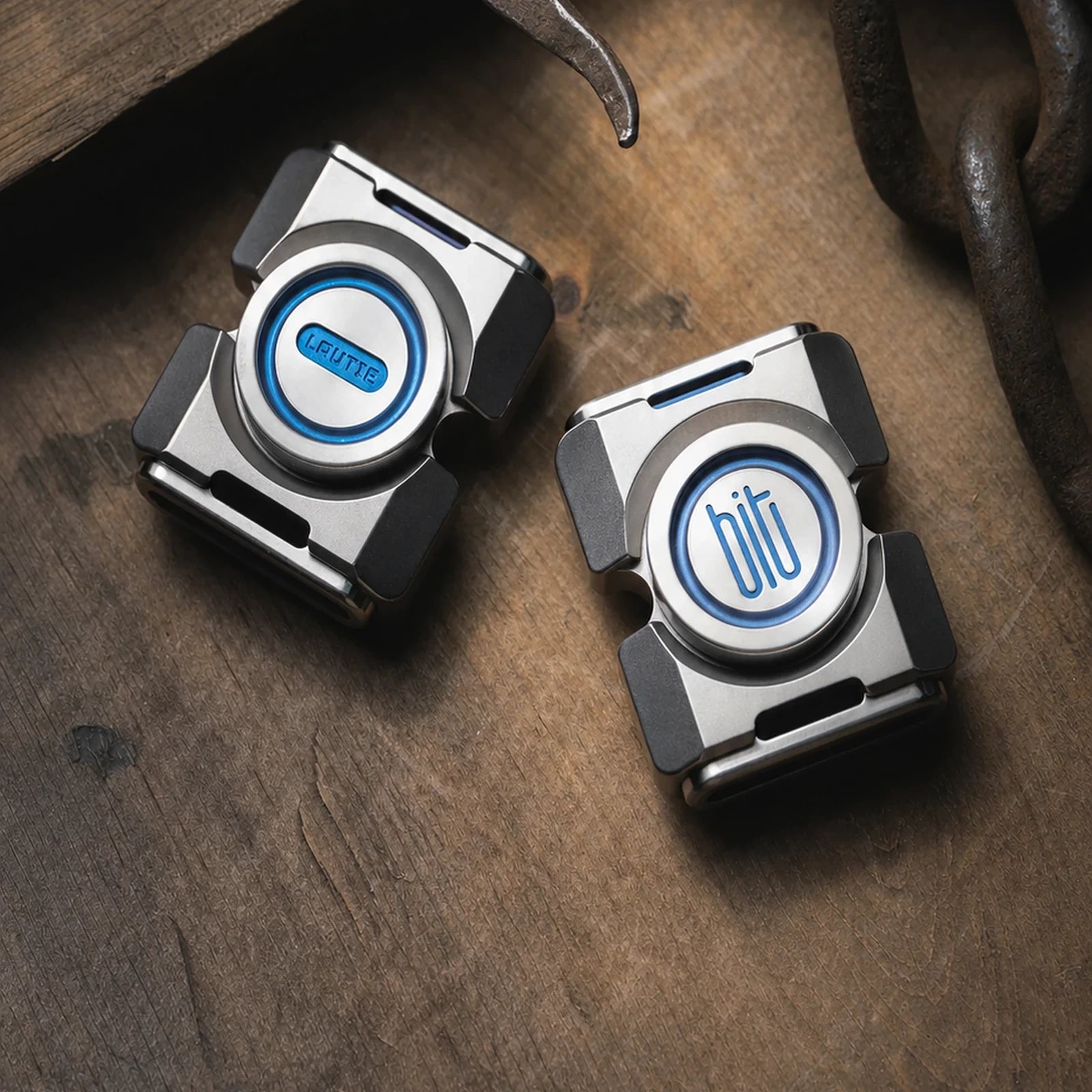 Two BIT-02 fidget spinners showing blue accents and two-lobe shapes