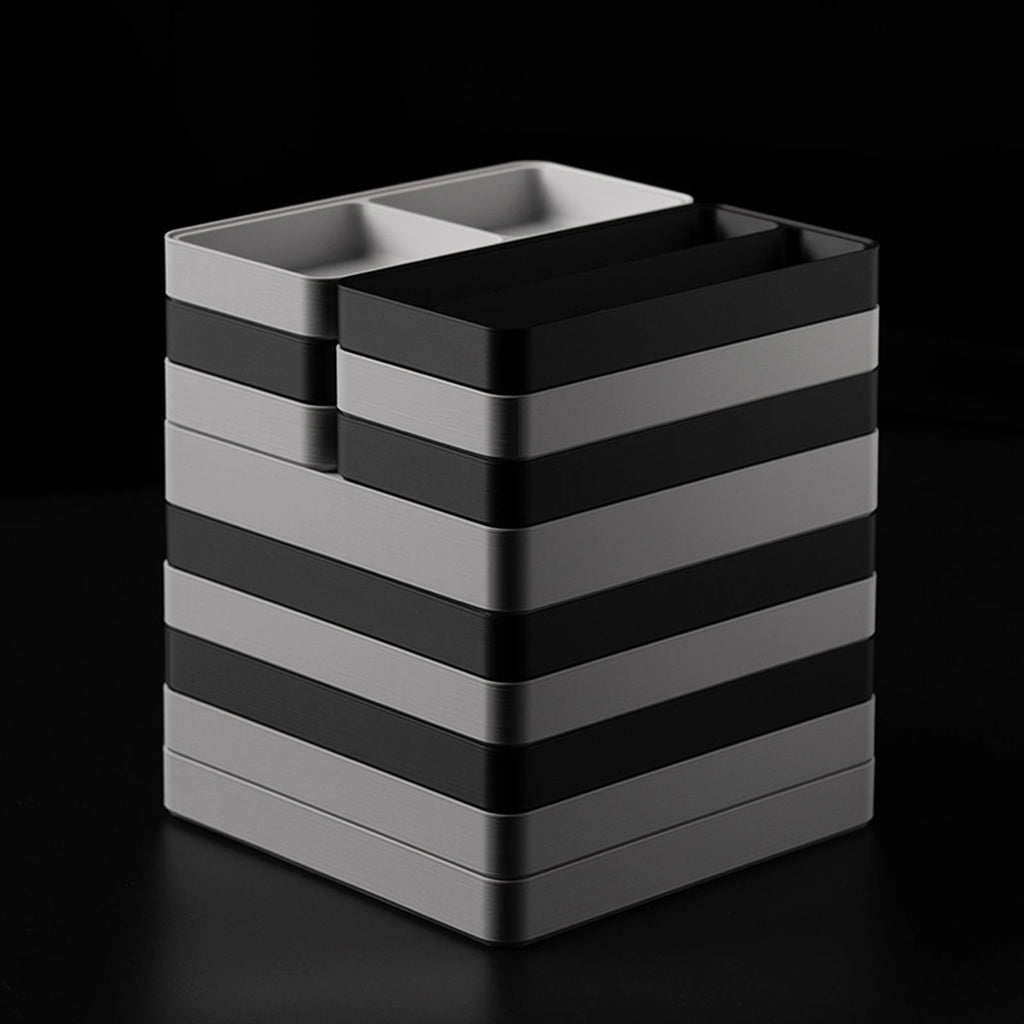 Black and gray organizer trays stacked in alternating layers