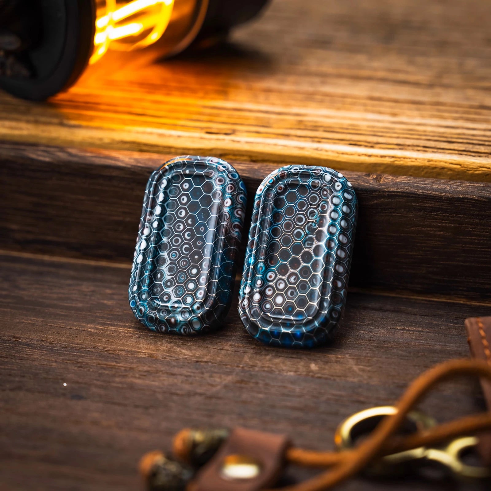 Two blue patterned outer shells with honeycomb surface detail