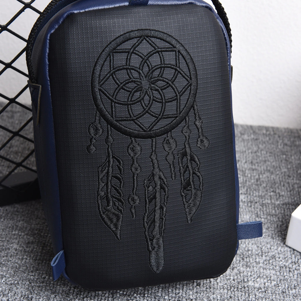 Front view of the compact EDC organizer bag with embroidered circular design
