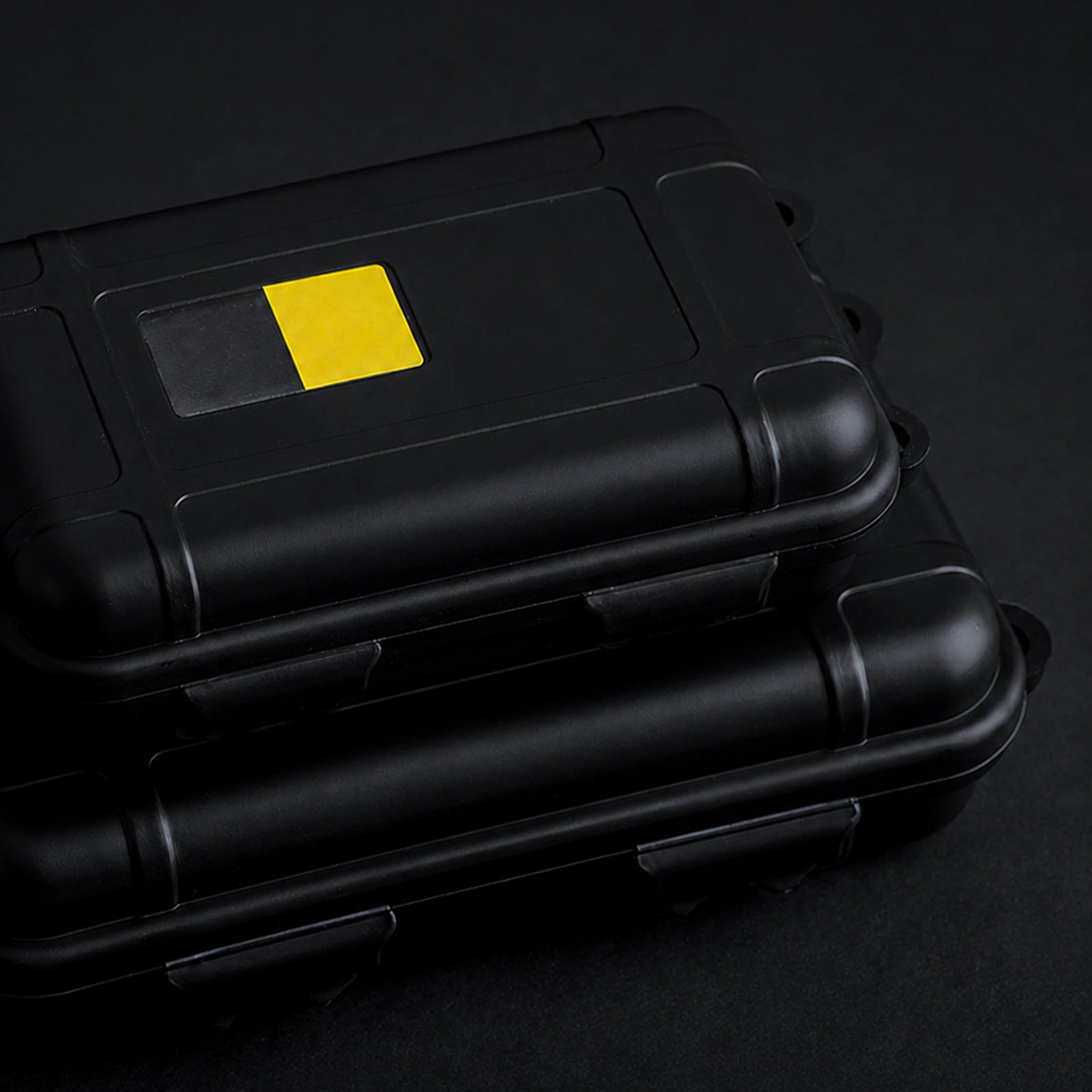 Small and large black storage cases shown together for size comparison