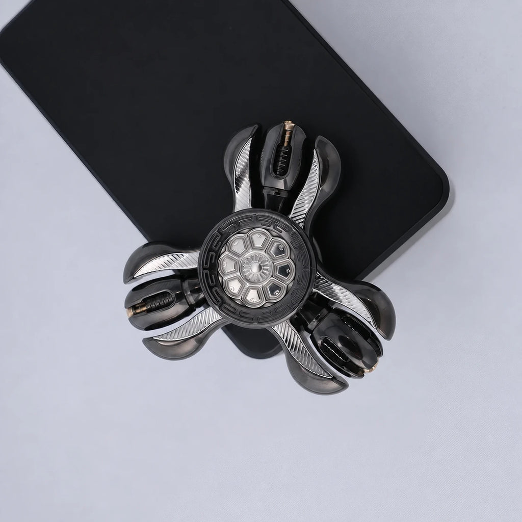 Black Prayer Wheel fidget spinner top view with three-lobe profile