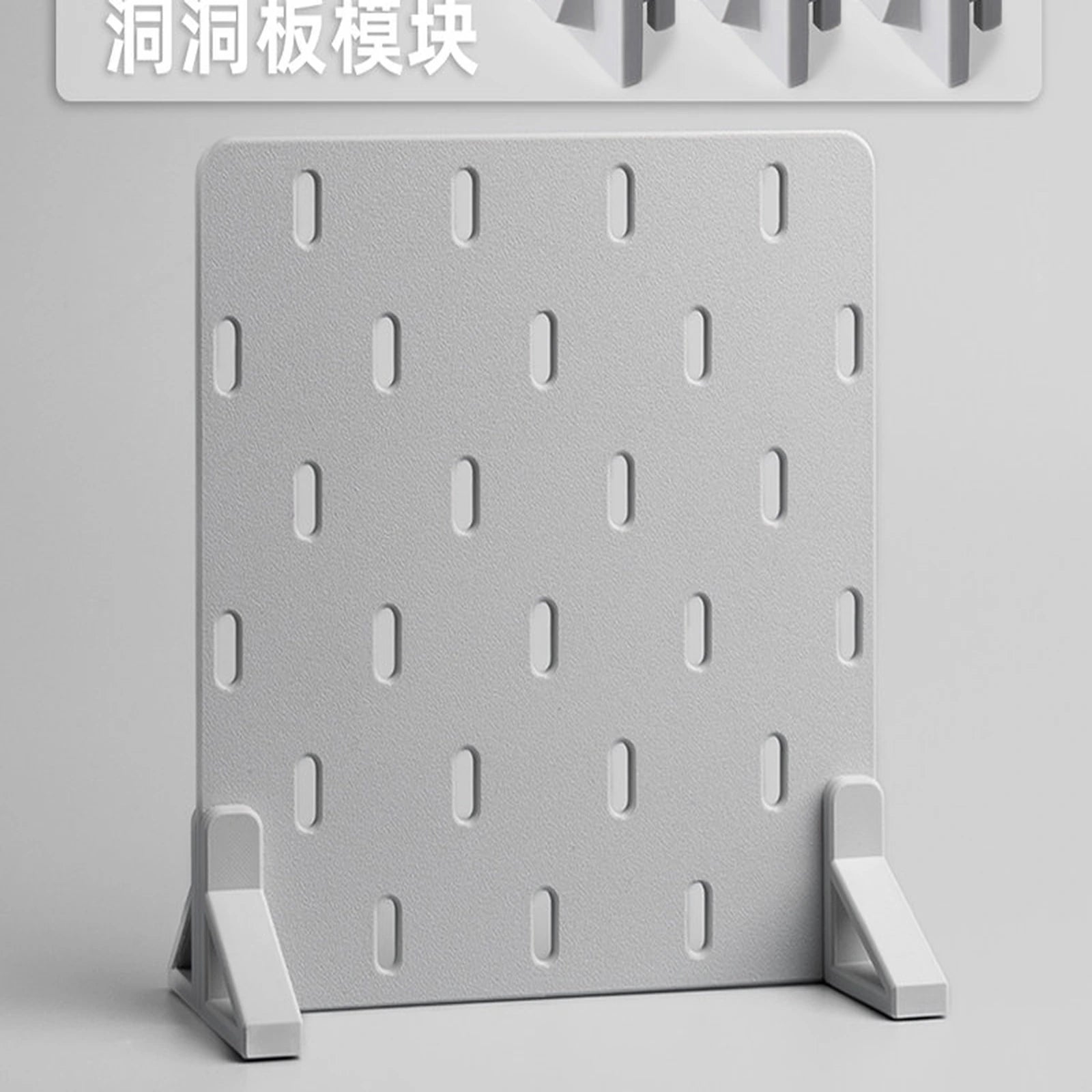 Light gray freestanding pegboard kit with three slotted panel sections