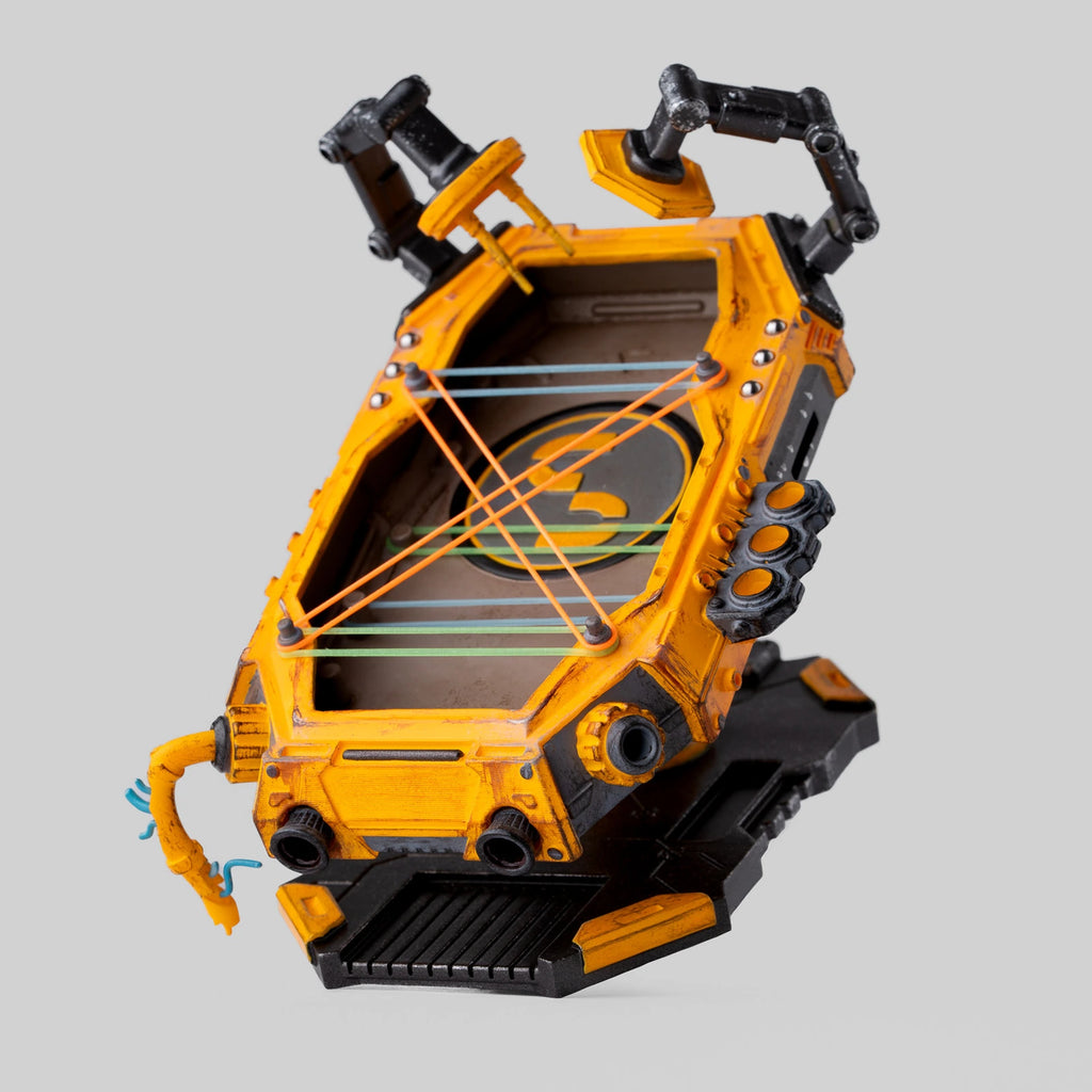 Yellow resin mechanical EDC display stand on a neutral background