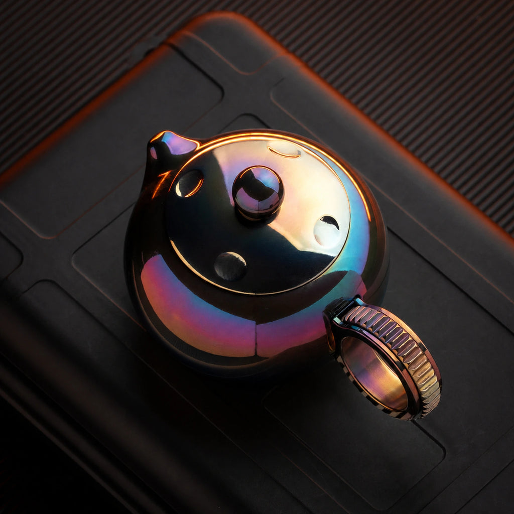Heat-colored zirconium alloy ratchet fidget toy variant