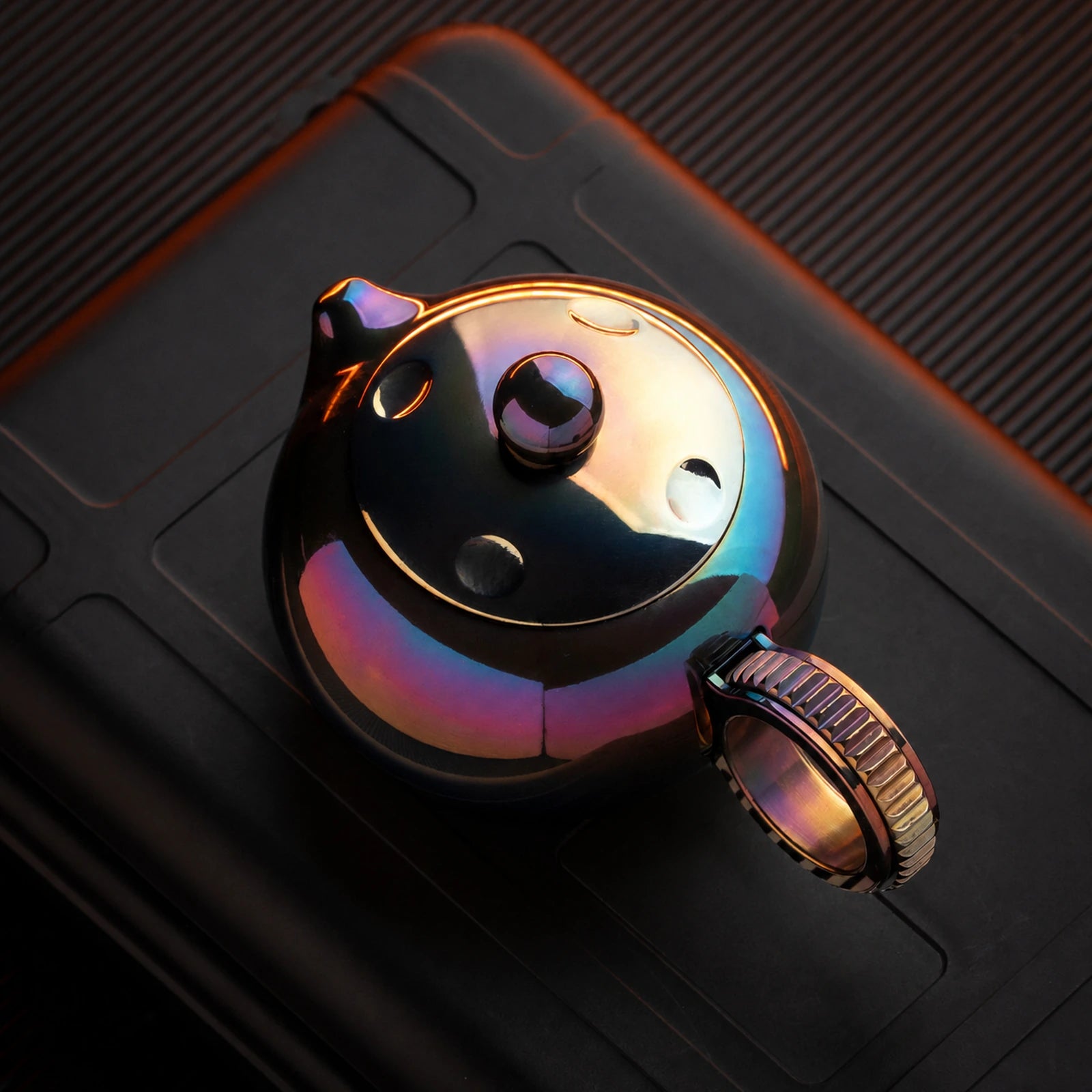 Heat-colored zirconium alloy ratchet fidget toy variant