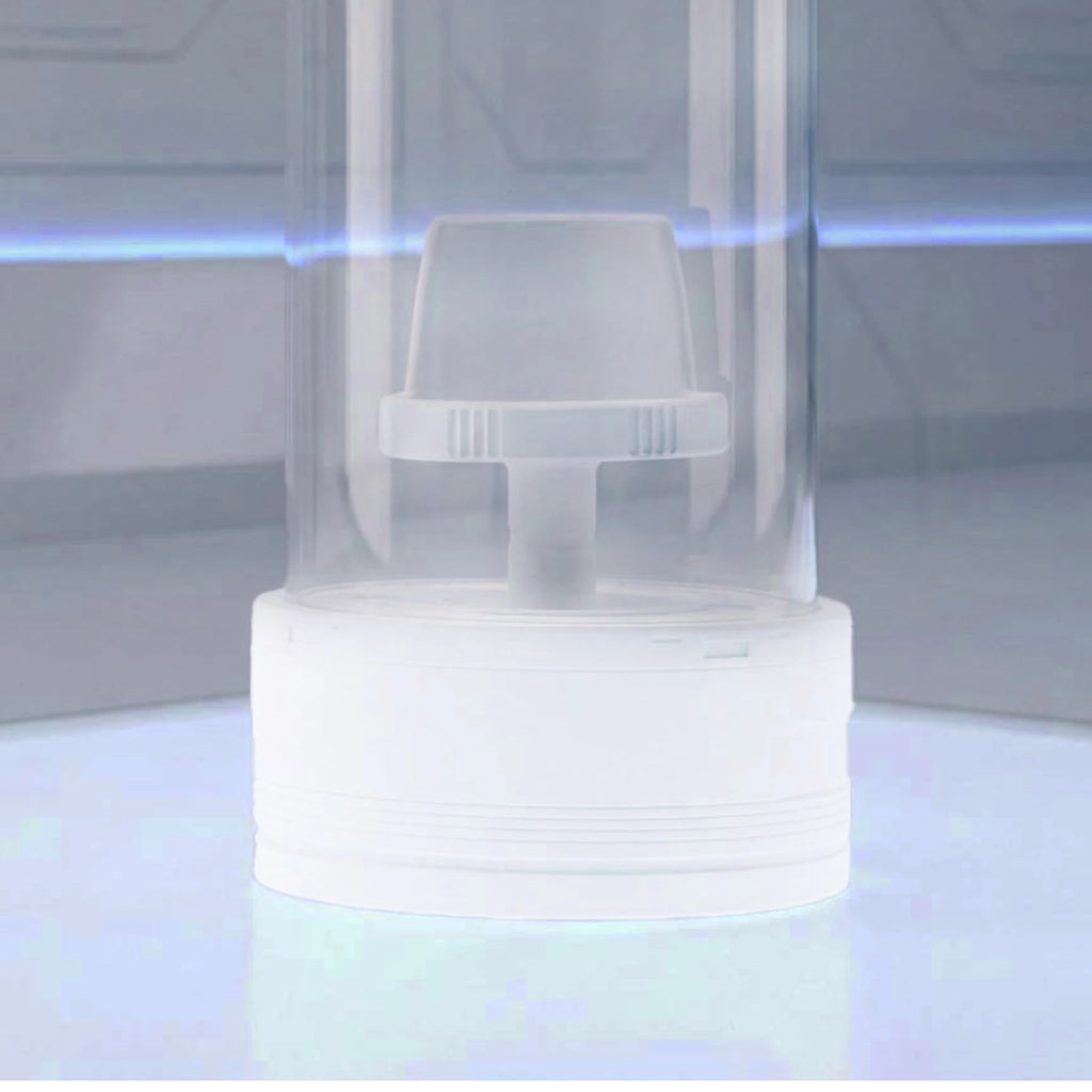 Close-up of the white display base illuminated on a desktop