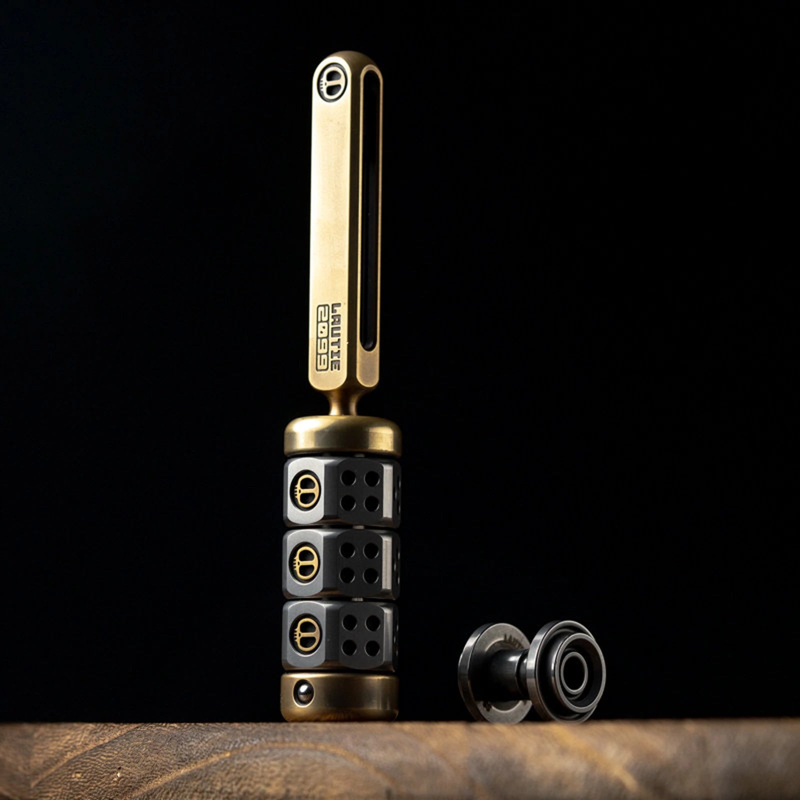 Magnetic ratchet fidget toy in handle set / brass + steel / stainless button configuration