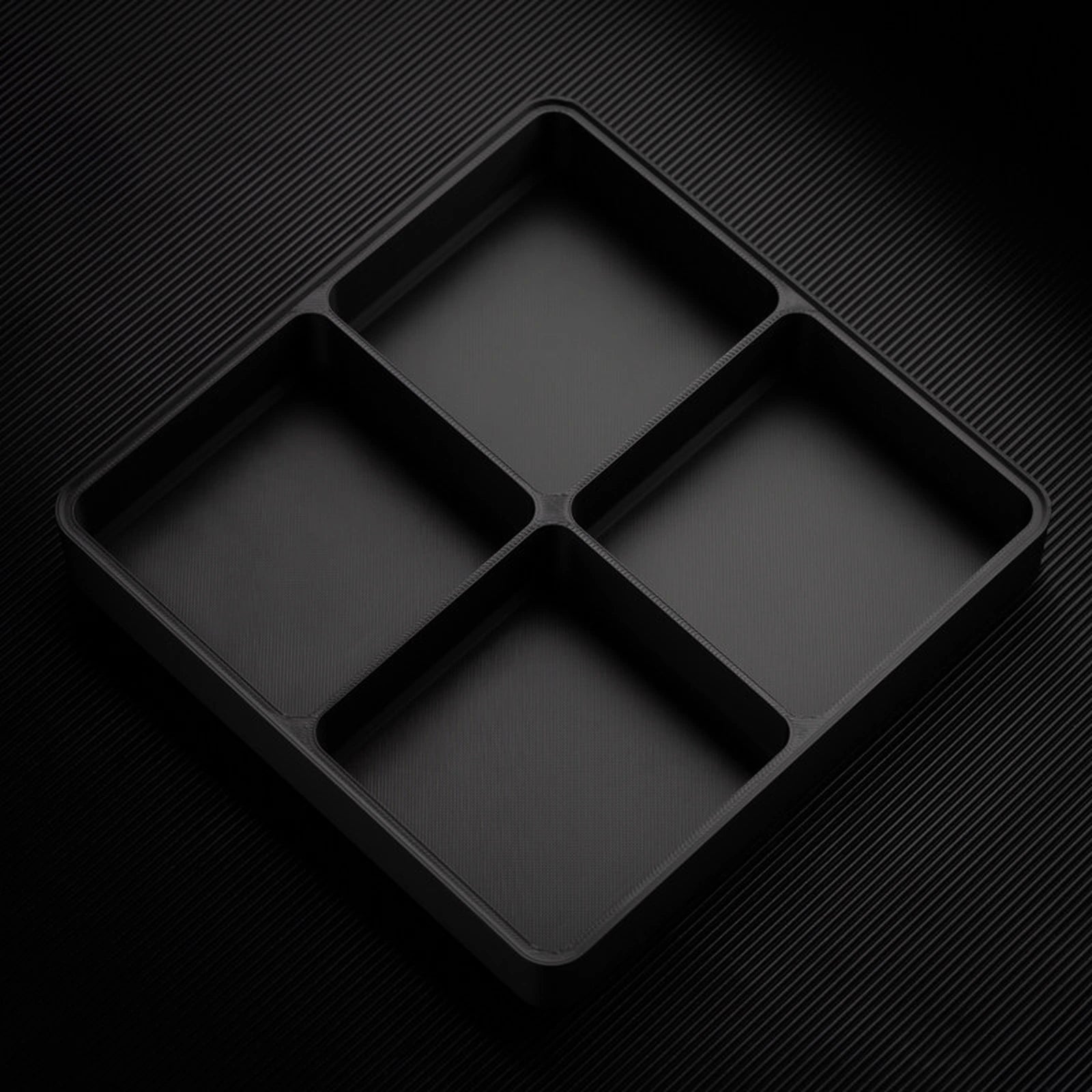 Black stackable organizer tray with raised 4 compartments layout