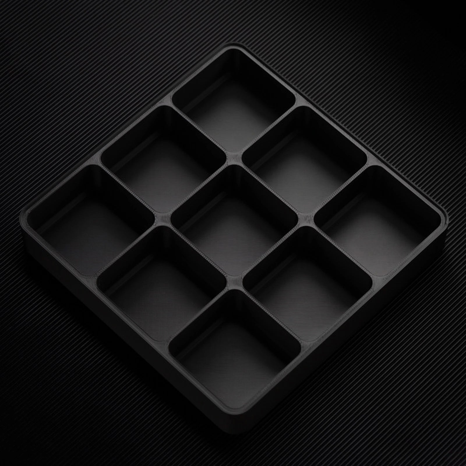 Black stackable organizer tray with raised 9 compartments layout
