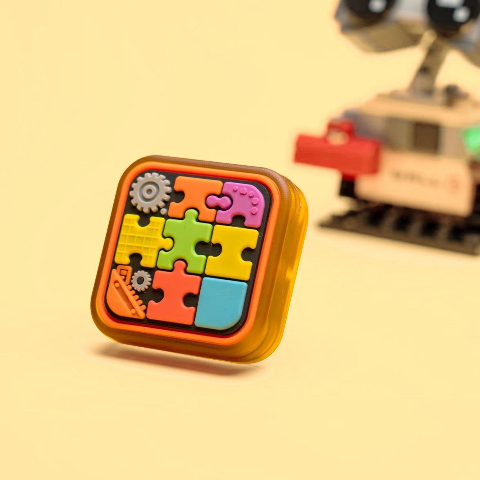 Amber PEI magnetic fidget slider with colorful silicone puzzle face