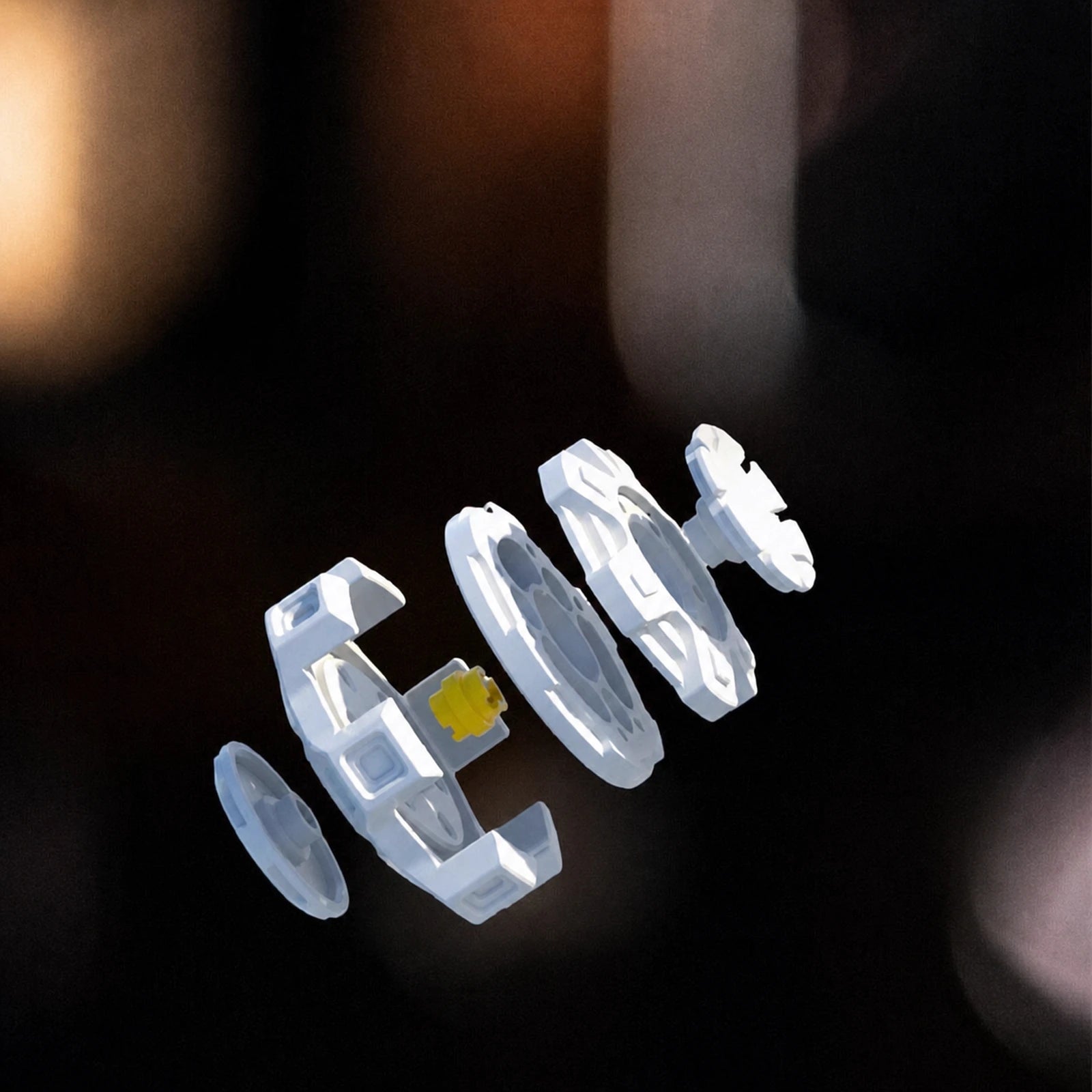Exploded assembly view of the five-arm mechanical linkage spinner