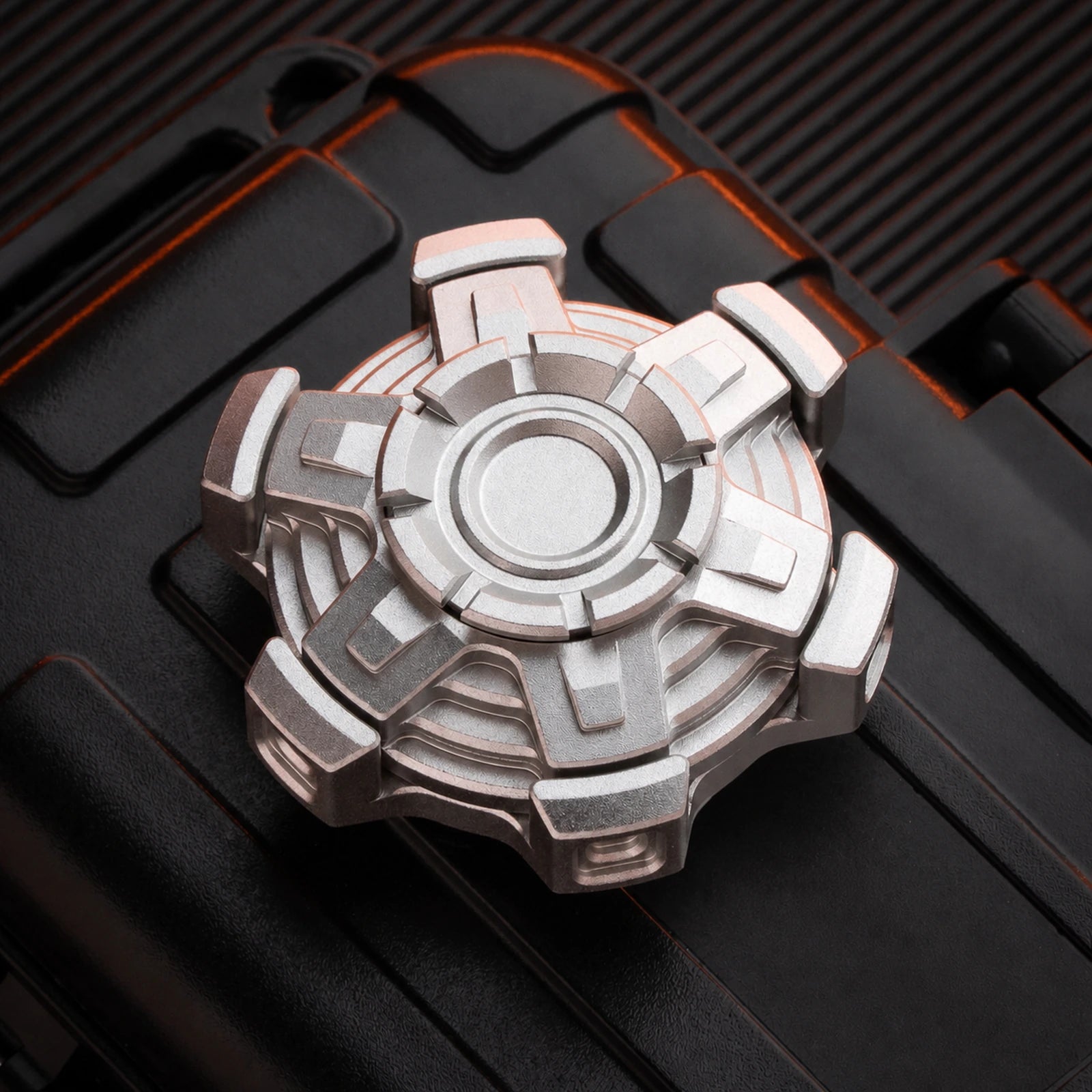Silver articulated fidget spinner with five-arm mechanical linkage frame